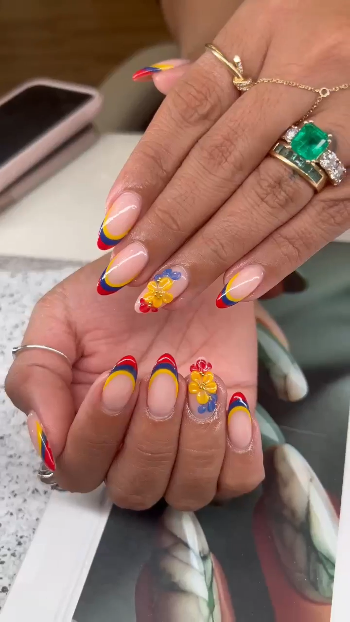 Colombian flag inspired nail art with flower accents