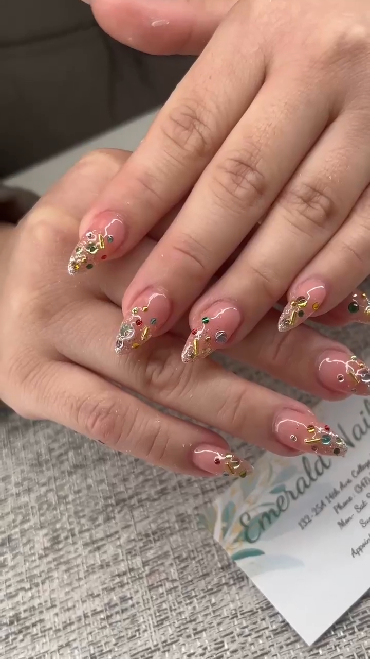 Detailed nail art with gem accents